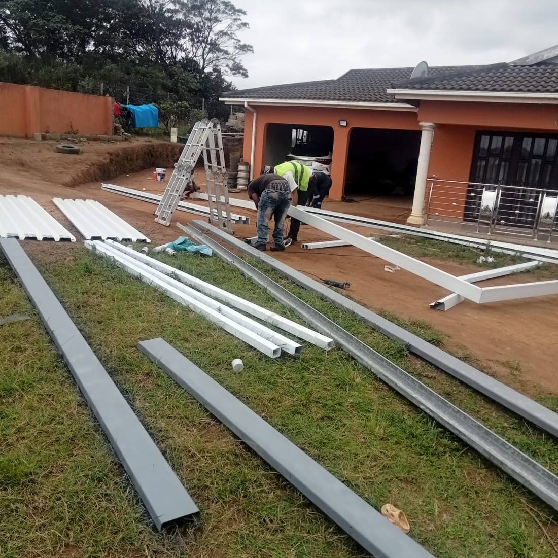 Carport steel frame fabrication and site prep