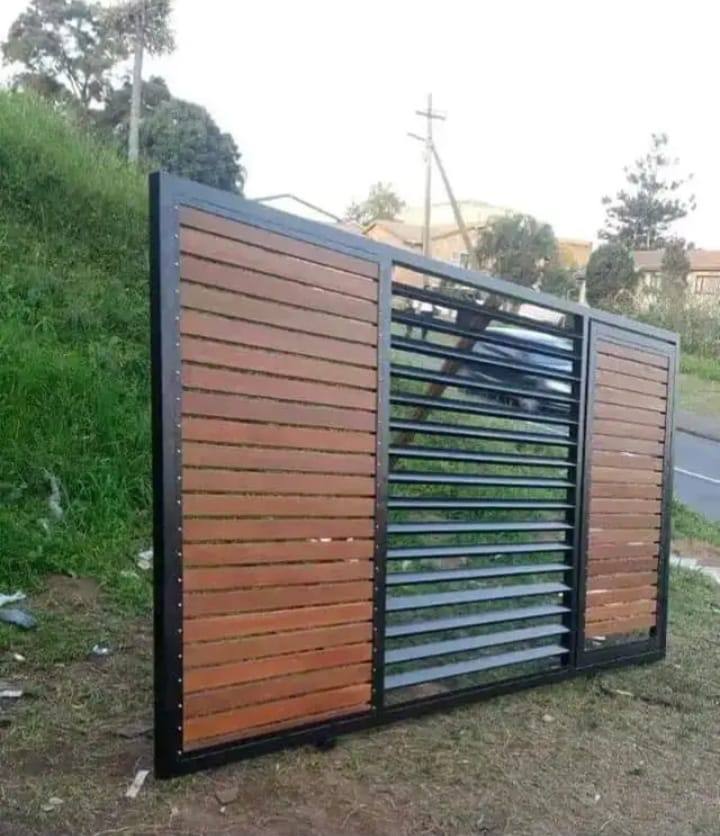 Custom slat driveway gate with steel frame